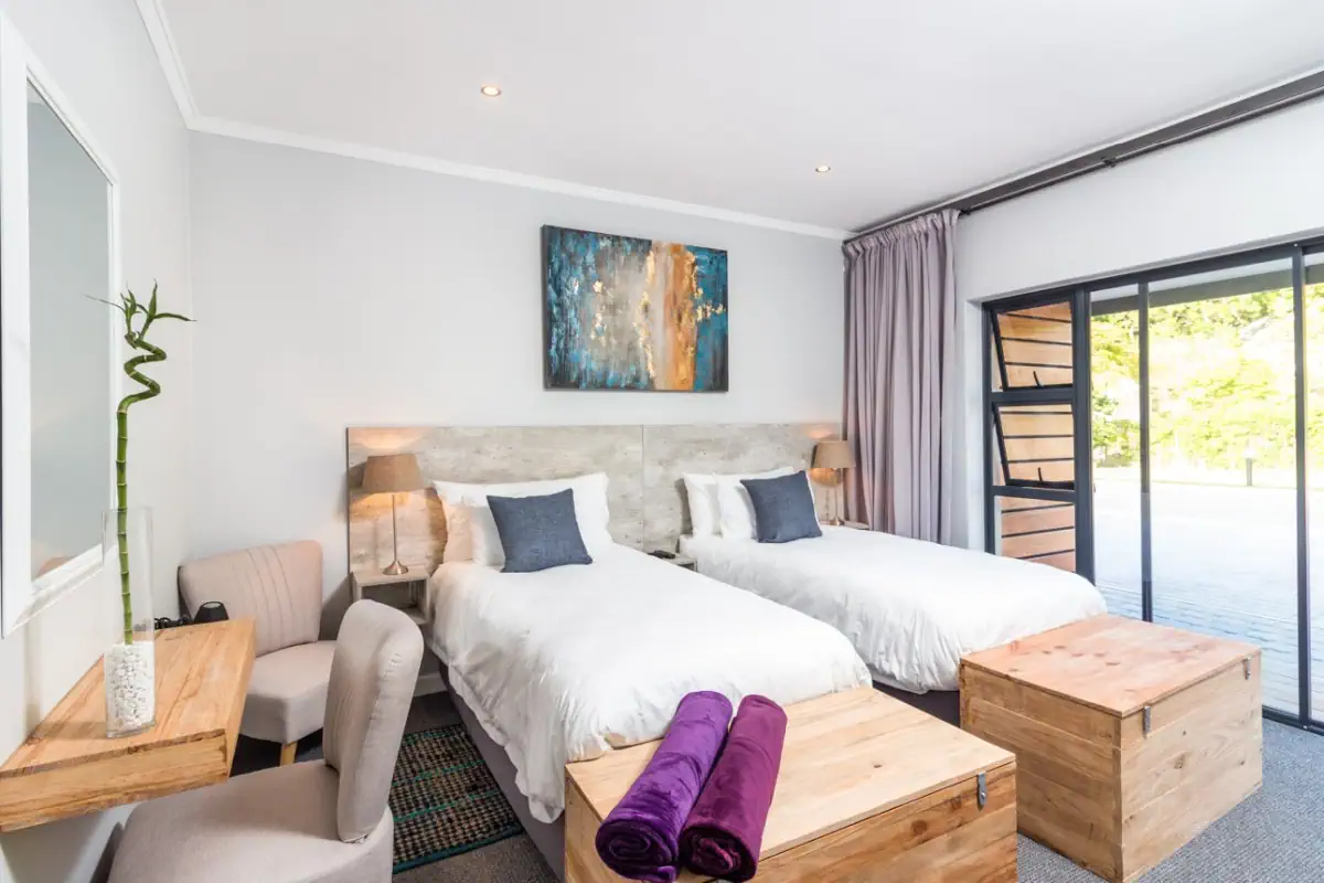 The room with a king-size bed with view to the patio