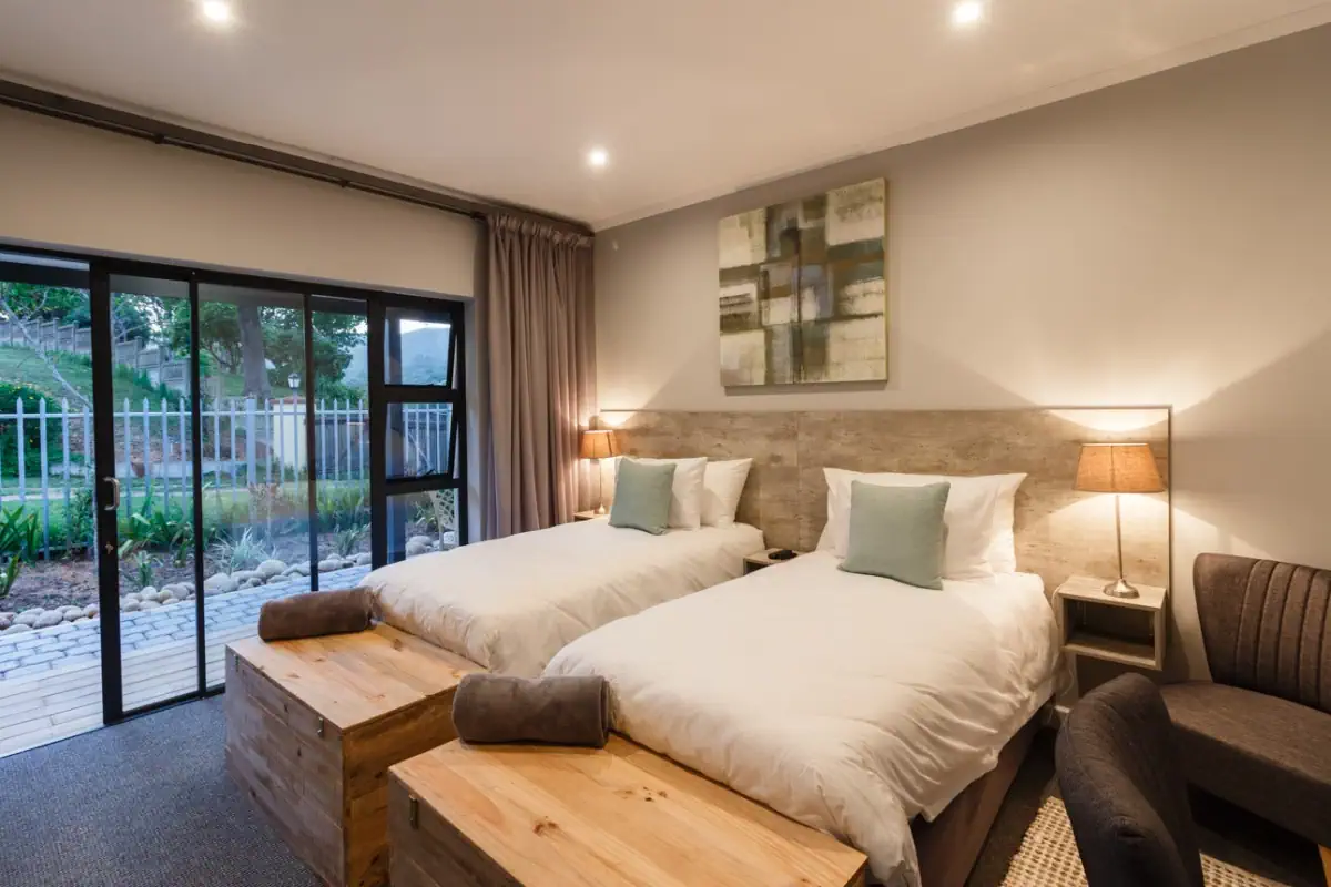 The room with two beds with view to the patio